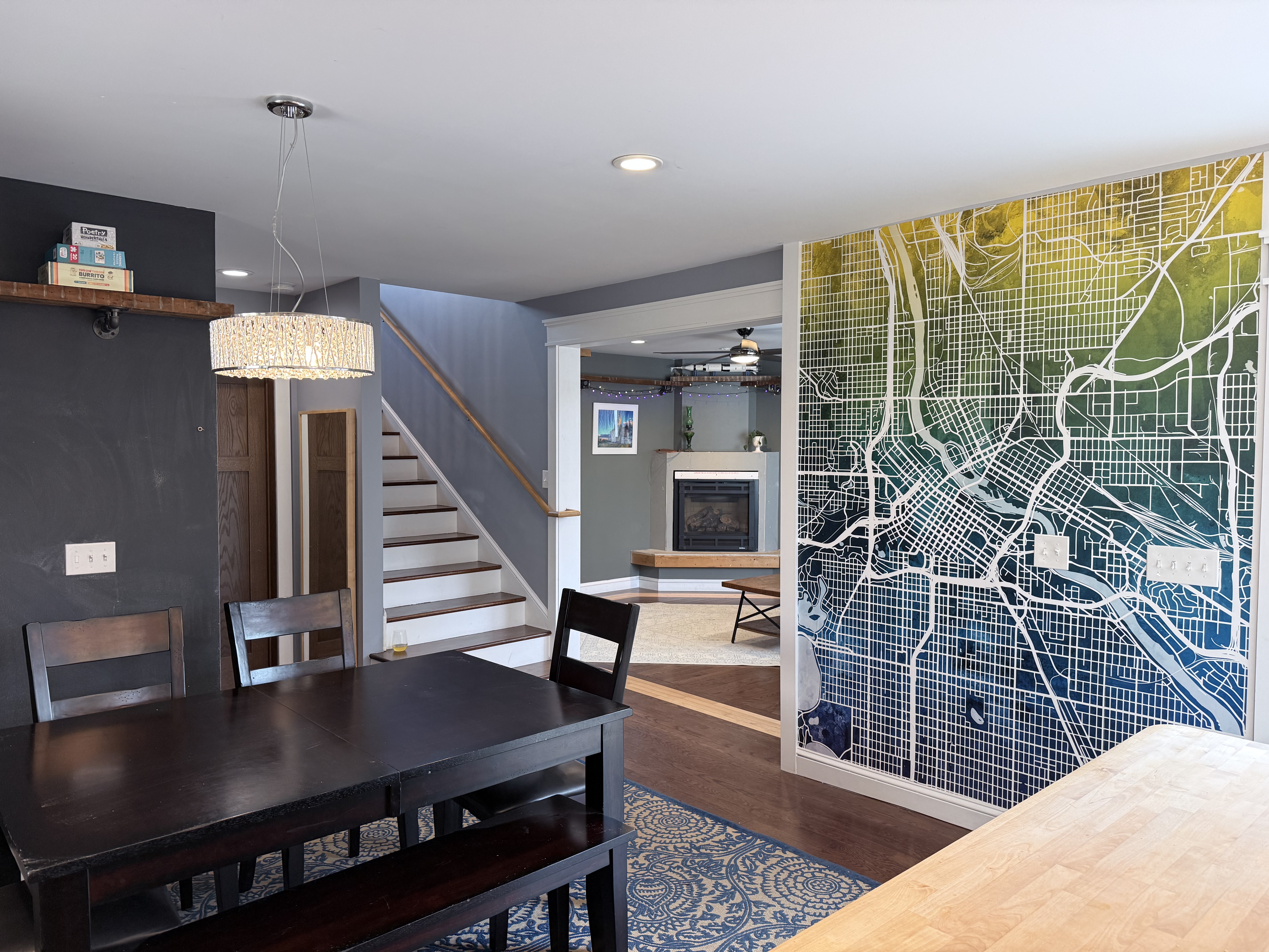 Dining area with Minneapolis map mural and staircase